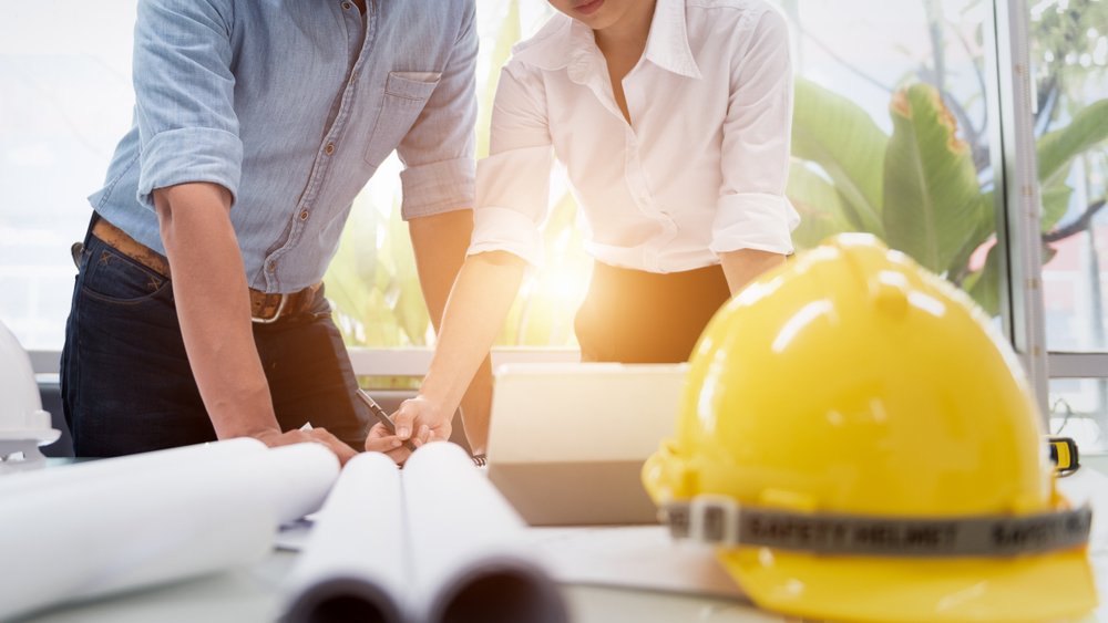Contractor & Designer People Drawing and Planning with Blueprint Architecture on Desk office. Drafting and Design Worksheets Before Starting the Project.