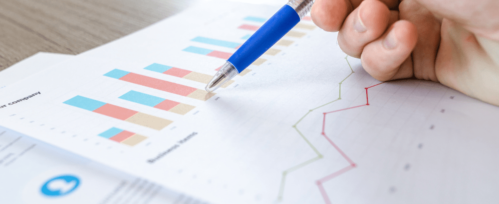 this image shows a person's finger holding a pen on the chart paper